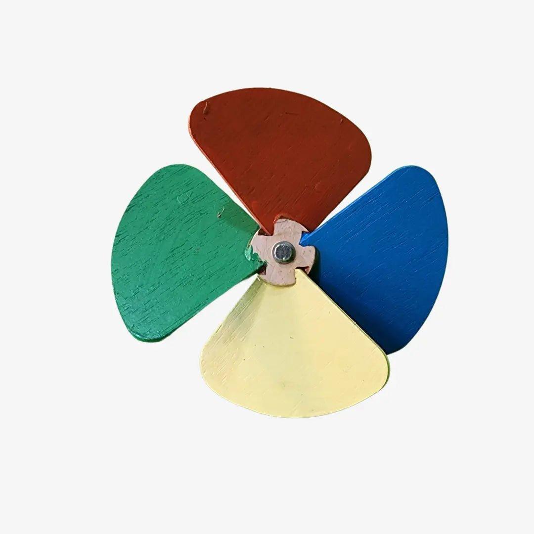 a multicolored wooden propeller on a white background