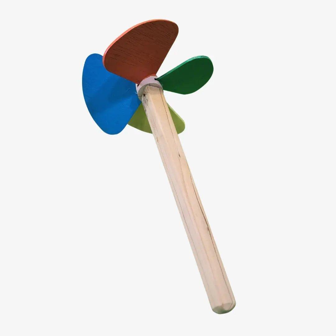 a colorful wooden toy windmill on a white background